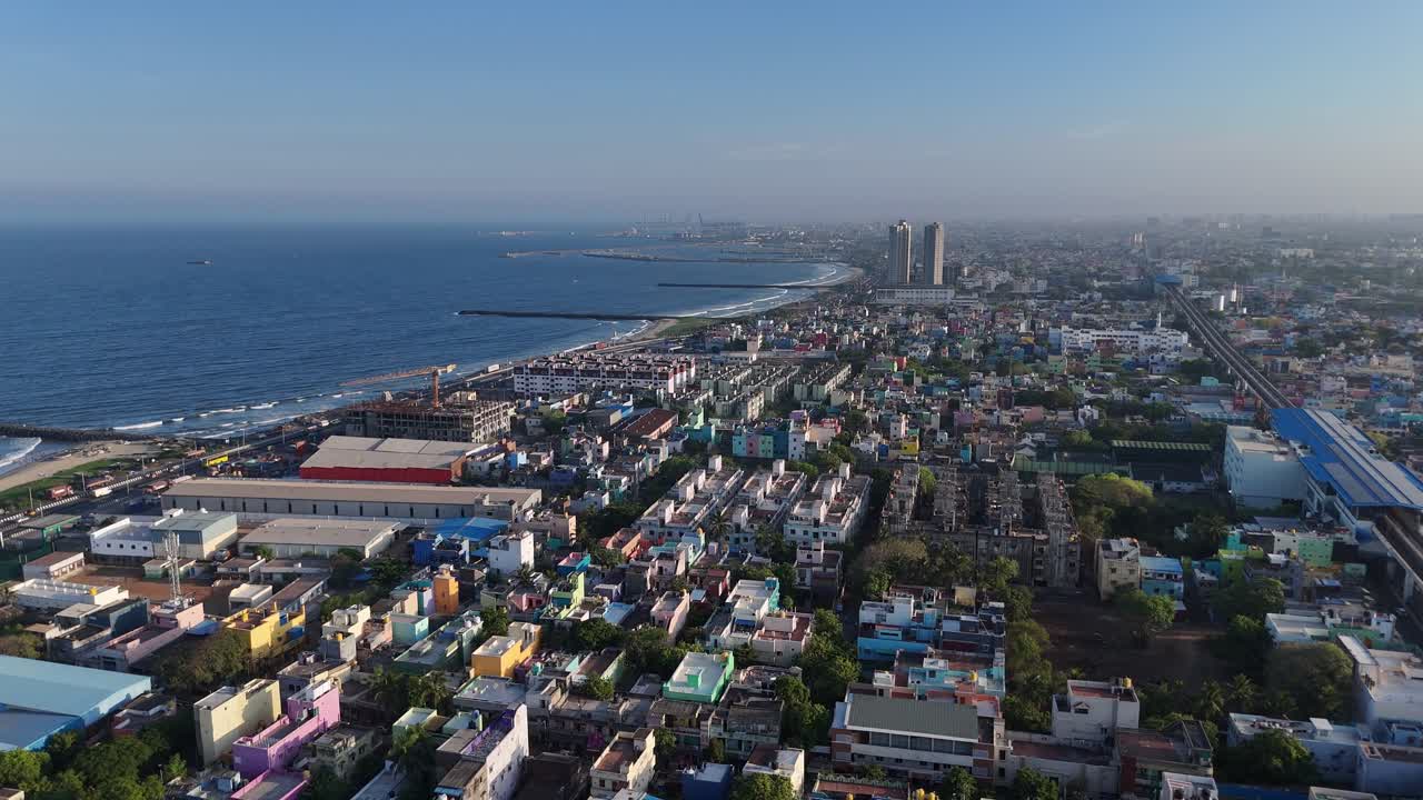 Aerial shot of beach shore located near north chennai filled with urban houses