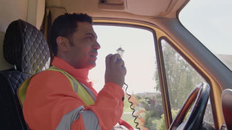 ambulance driver talking by radio and receiving information from the hospital