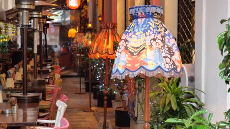 cozy outdoor cafe with colorful lamps