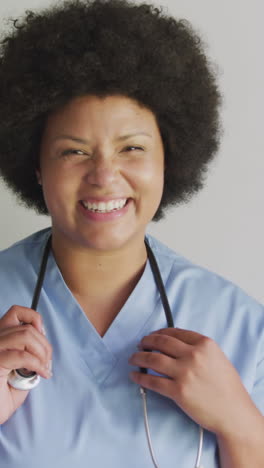 video of happy plus size african american female doctor looking at camera