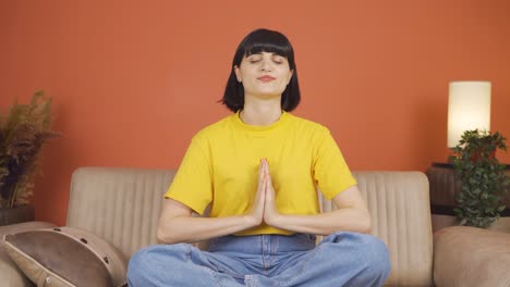 Woman-meditating-looking-at-camera.