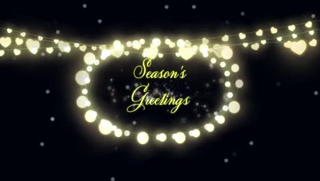 seasons greetings text and fairy lights against glowing spots on black background