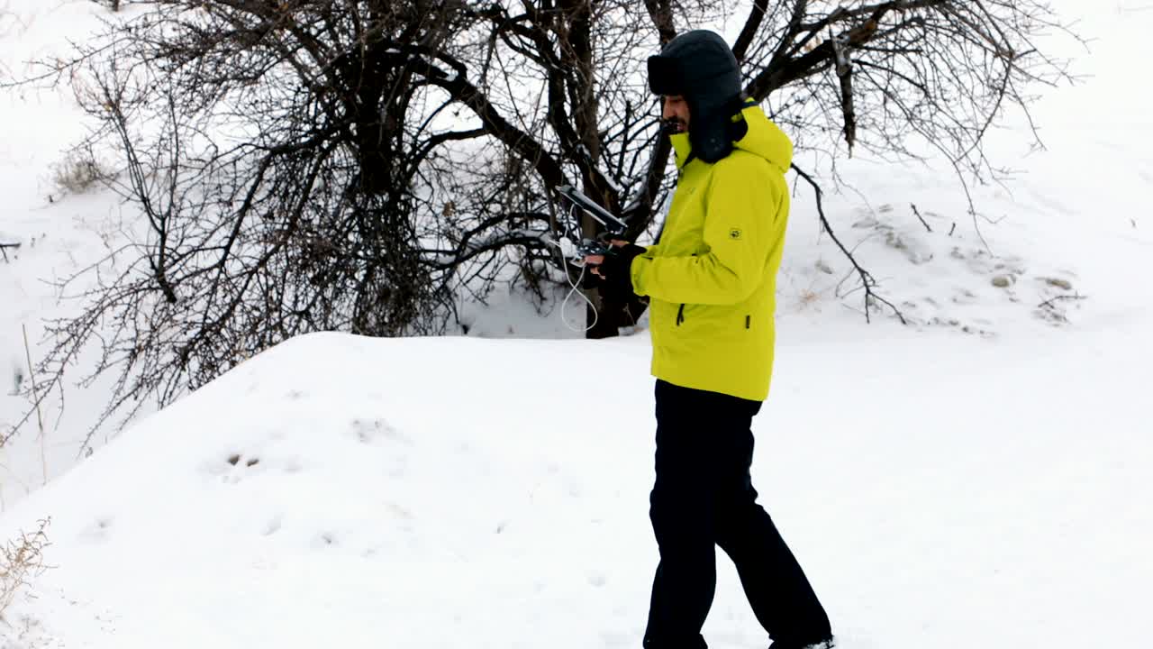 Man controls quadrocopter flight