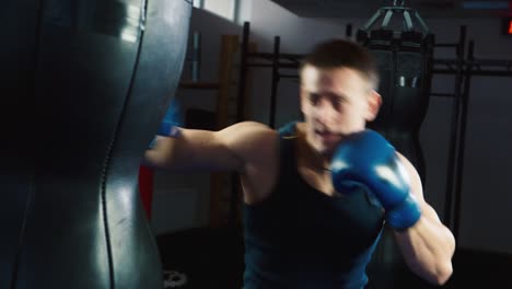 a young boxer practices punches on a punching bag 2