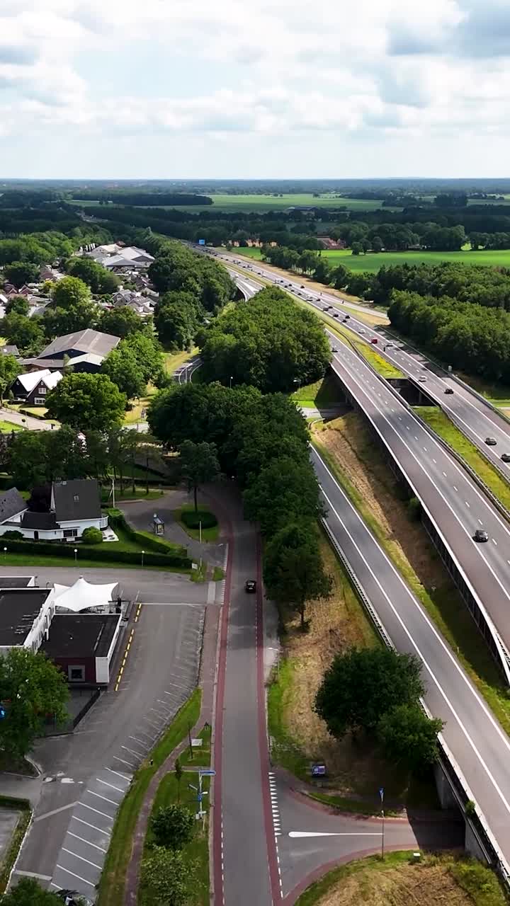 Aerial View of a Busy Highway Interchange with Lush Green Landscape