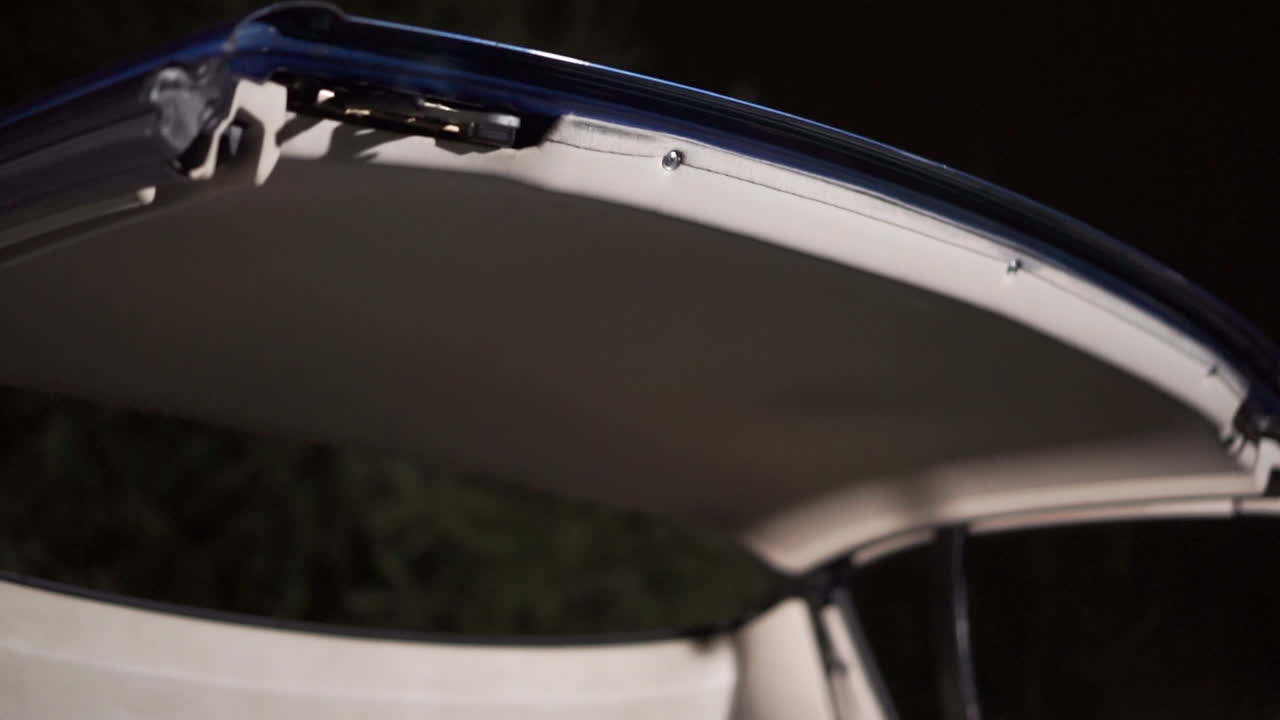 Open Convertible Car Top at Night