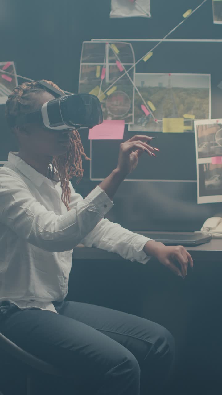 Vertical video: Private detective working with 3d vr glasses