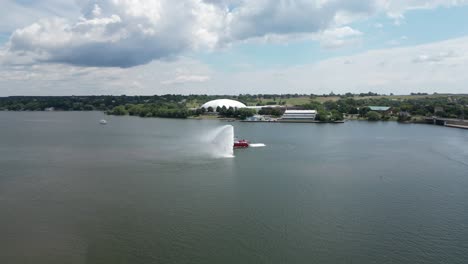 Aerial-view-of-a-fire-boat-doing-a-test-in-open-water