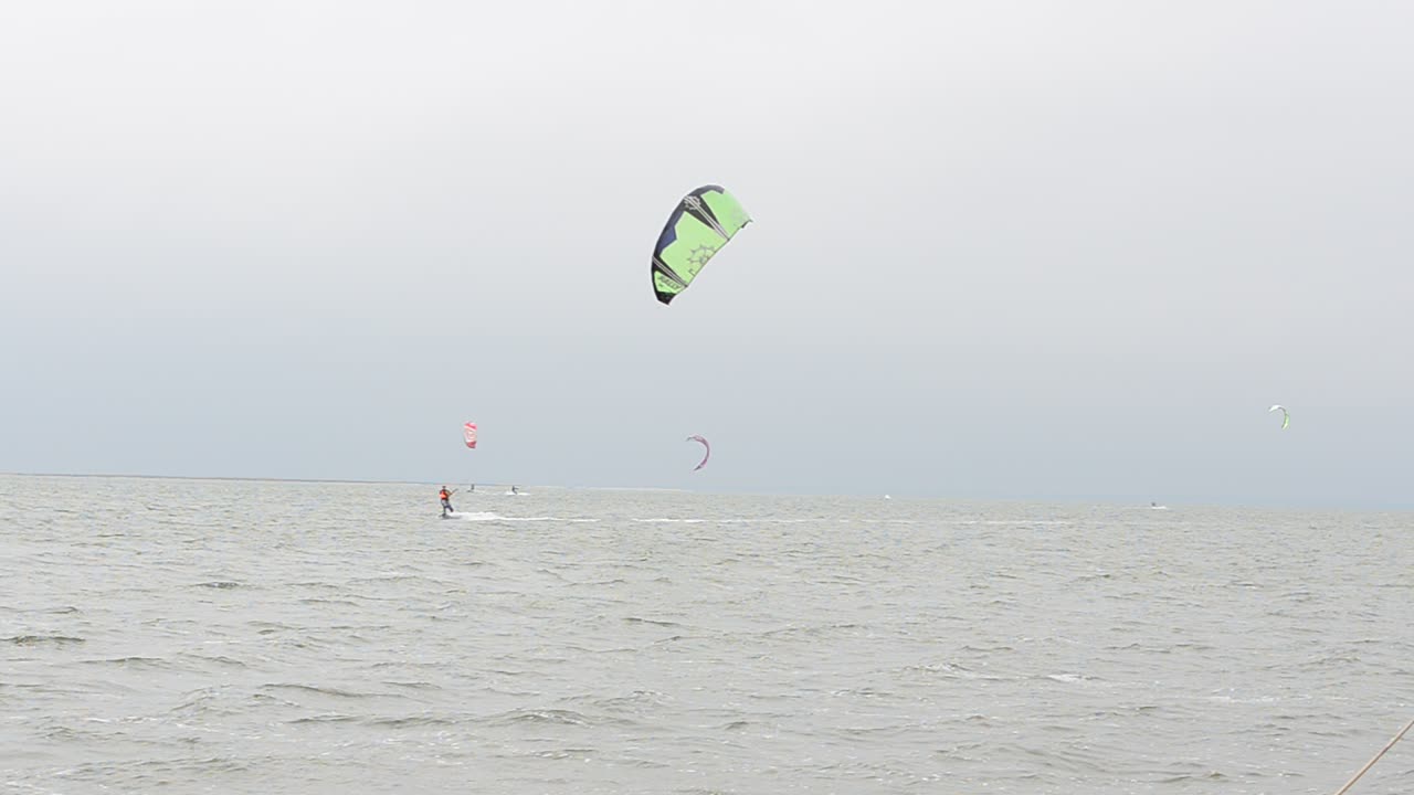 Driving on a board under a sail. Shooting at the sea