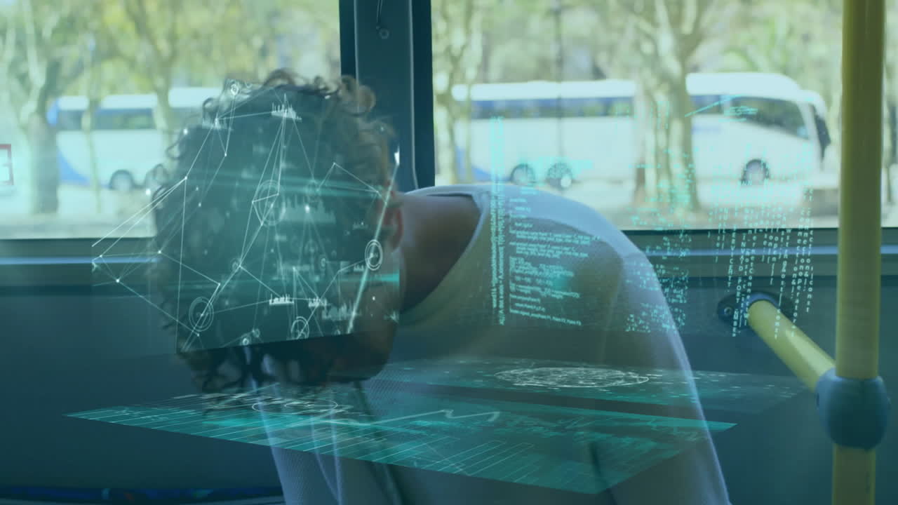 Resting on bus, person viewing animation of digital data and network graphics