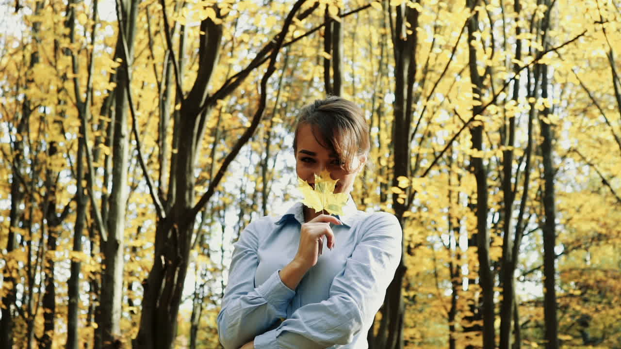 Woman posing in park. Happy young woman posing in autumn park