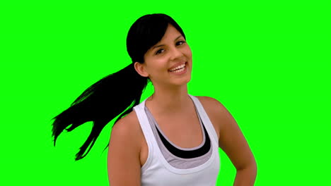 Woman-in-sportswear-tossing-her-hair-on-green-screen