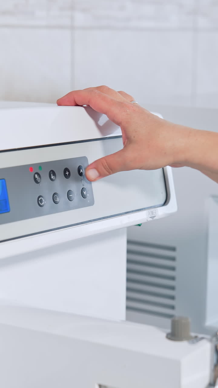 Technician holding samples in laboratory. Young lab assistant testing samples in hospital. Vertical video