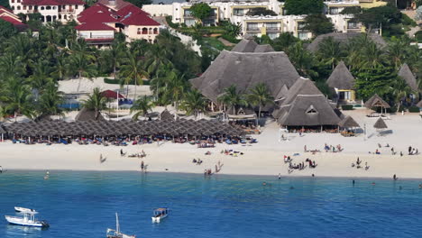 aerial view of zanzibar beach where tourists and locals mix together of colors and joy, concept of summer vacation, aerial view of kendwa beach, tanzania