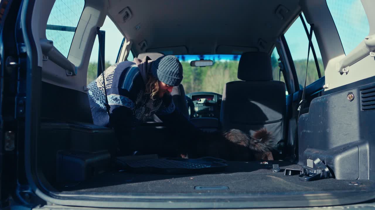 A Man Prepares the Interior of a Pajero by Removing Components For Vehicle Modification - Close Up