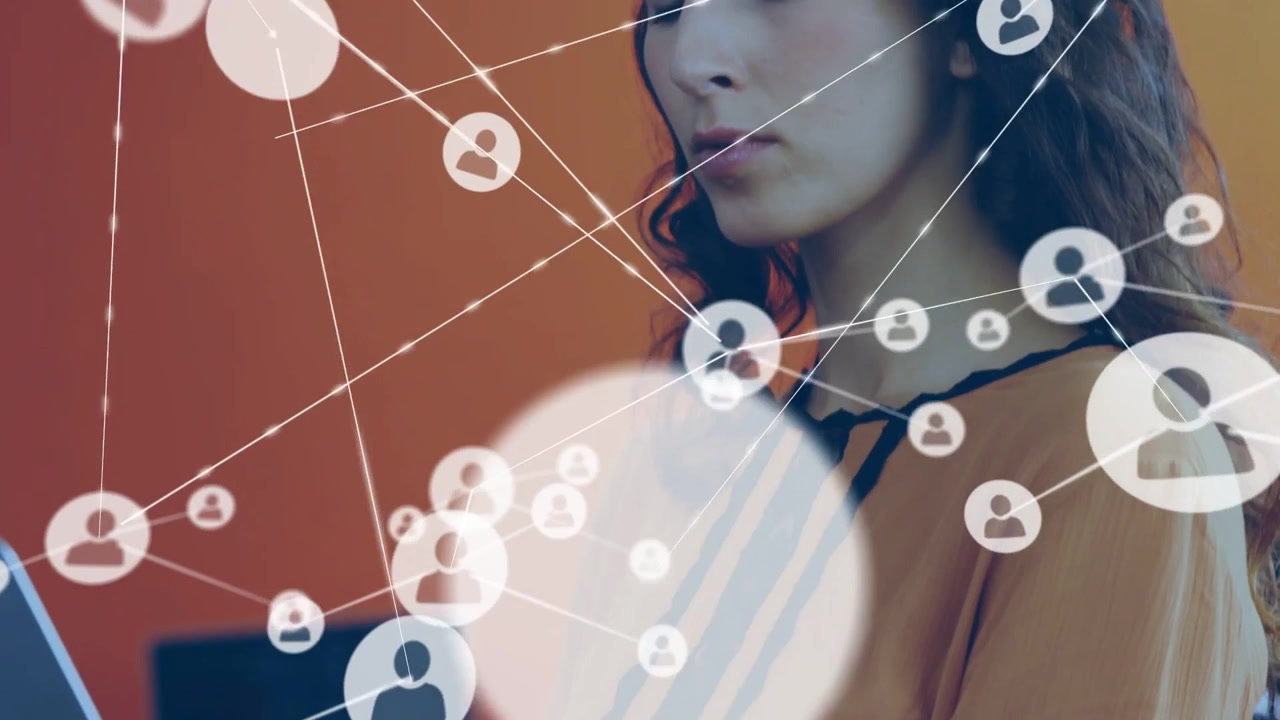Woman typing on laptop, causing network icons to expand across face, showing business network