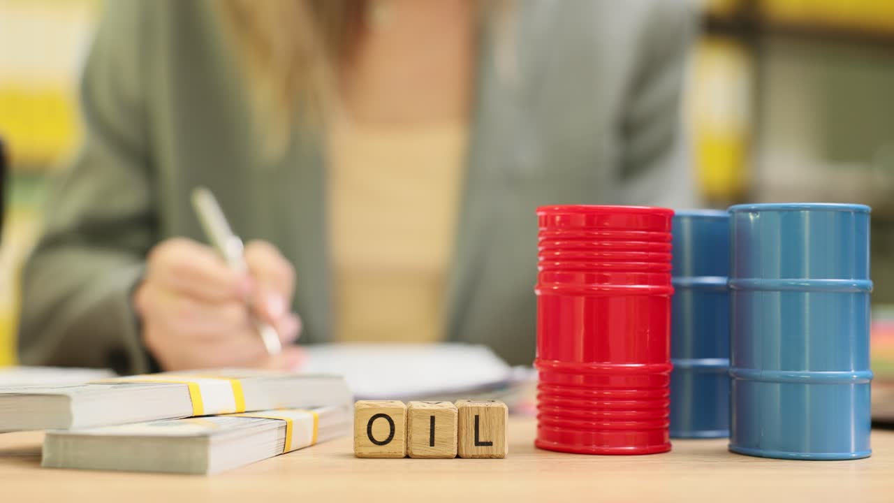 Business Person Stamping Documents with Oil and Money on Desk