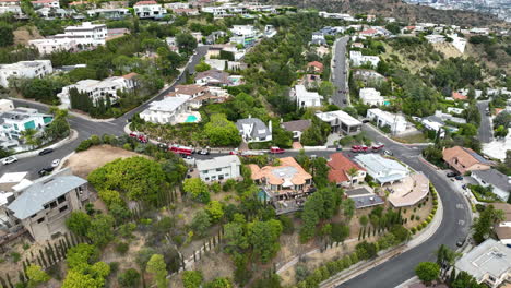 aerial view of firetrucks at a neighborhood in los angeles, cloudy day in usa