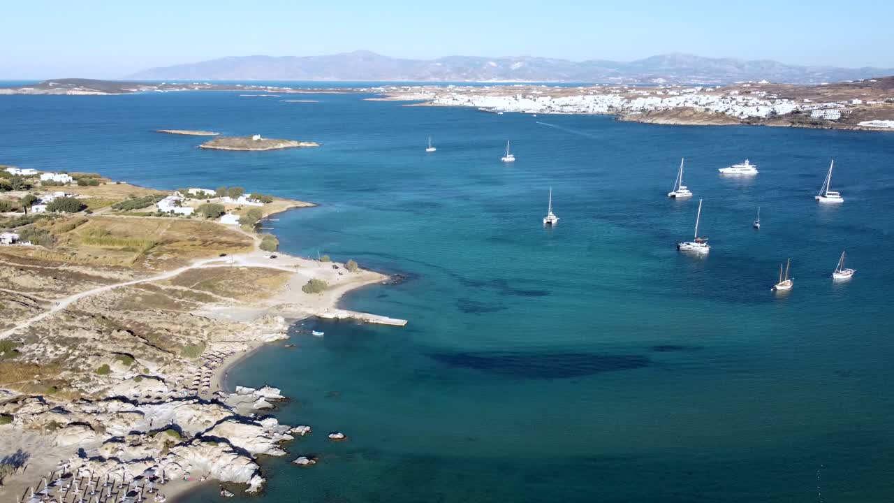 Aerial Orbit over Kolymbithres and Paralía Molos Beach Coastline, Bay of Naousa, Paros