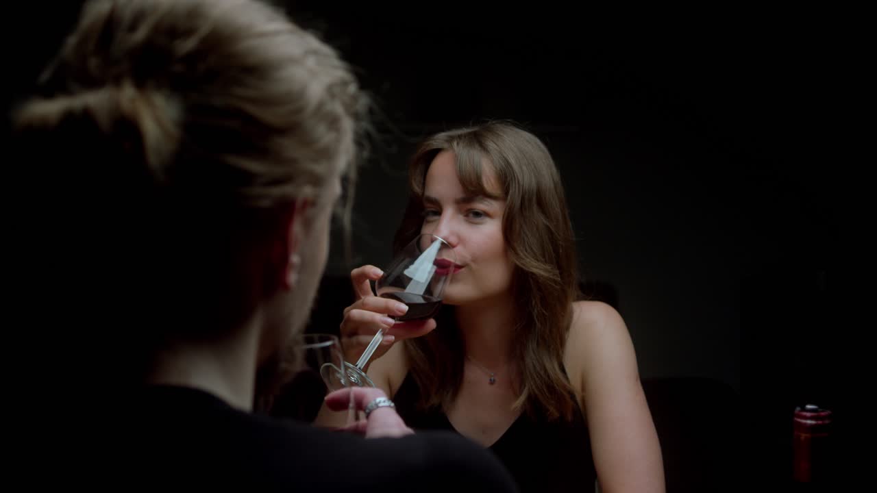 Two Women Enjoying a Glass of Red Wine Together