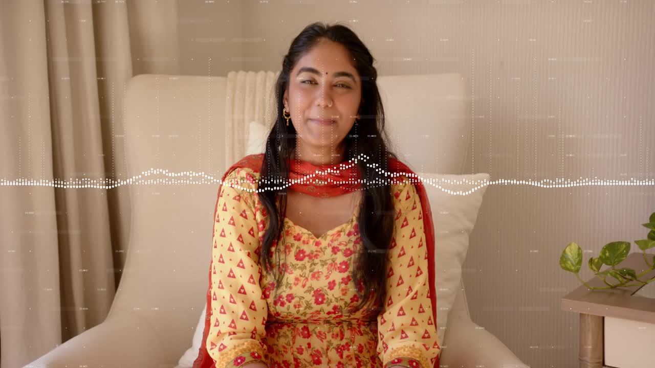 Woman in chair speaking with audio starting for podcast, waveform syncing to mouth movements