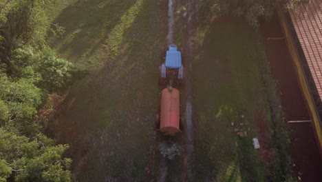 tractor with fertilizer spreader preparing for planting on land in the interior of brazil