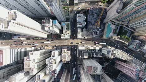 Downtown-Hong-Kong-city-skyscrapers-and-urban-traffic,-Aerial-view