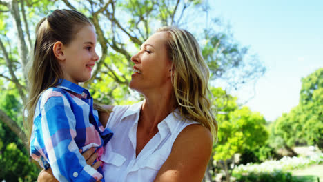 Mother-and-daughter-embracing-each-other-in-park-4k