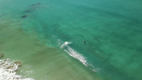 Surfer-catching-wave-shortly-before-being-wiped-out-from-barrel