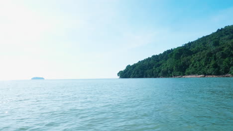 tranquil beach scene with lush landscape