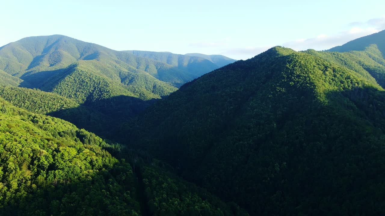 Golden hour highlights the Apennine Mountains - serene Italian hills at sunset