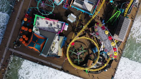 aerial top down shot over the santa monica pier, sunny day in los angeles, usa