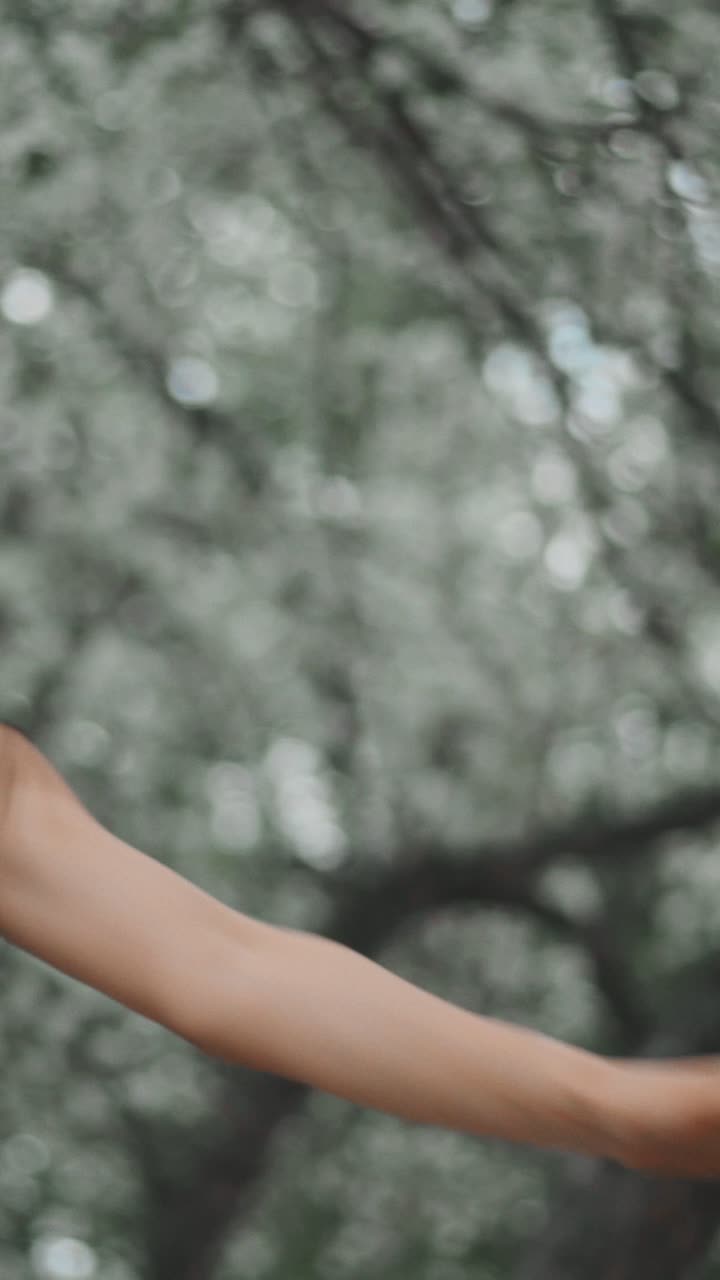 Woman in a Blue Dress Amongst Spring Blossoms