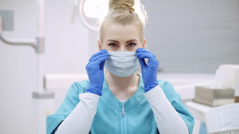 dentist putting on protective mask before surgery 3