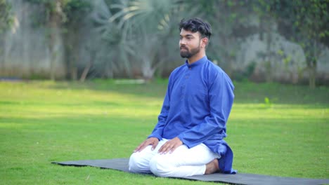 Happy-Indian-man-doing-yoga