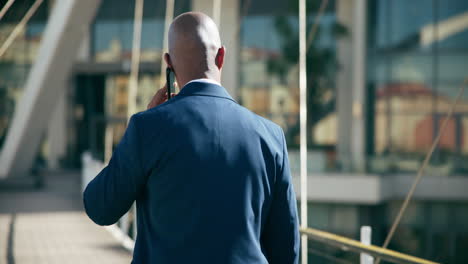 businessman talking on phone in city