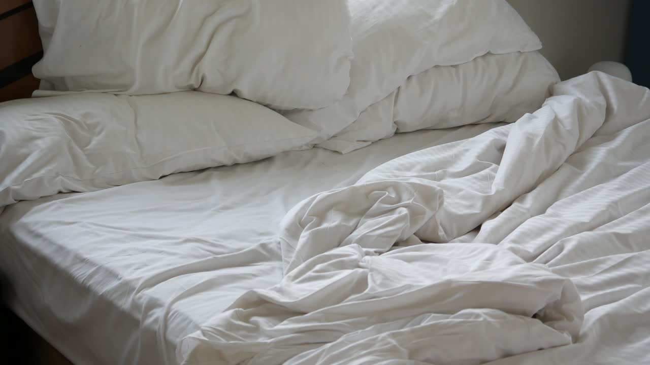 Premium stock video - Messy bed in early morning , messy bed after ...