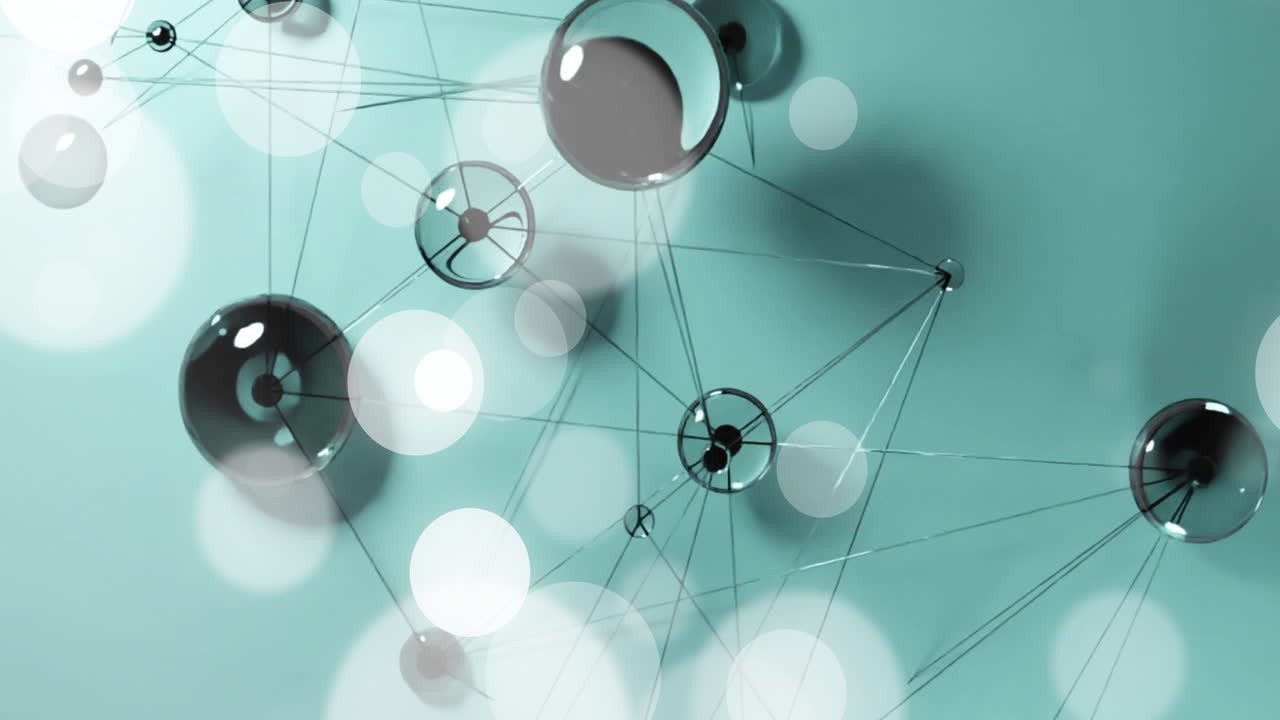 Animation of interconnected spheres and lines on teal background forming network