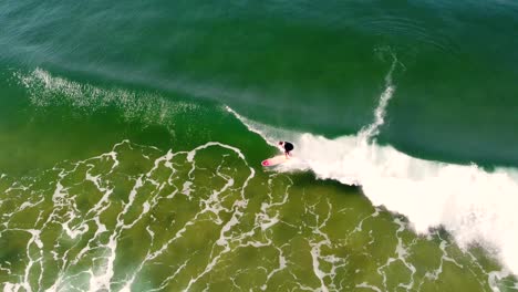 drone aerial shot of malibu longboard surfer on ocean wave surfing at terrigal beach nsw central coast australia 3840x2160 4k