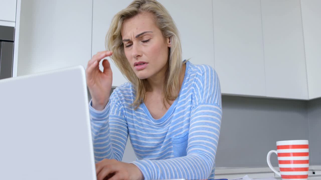 Worried woman with laptop