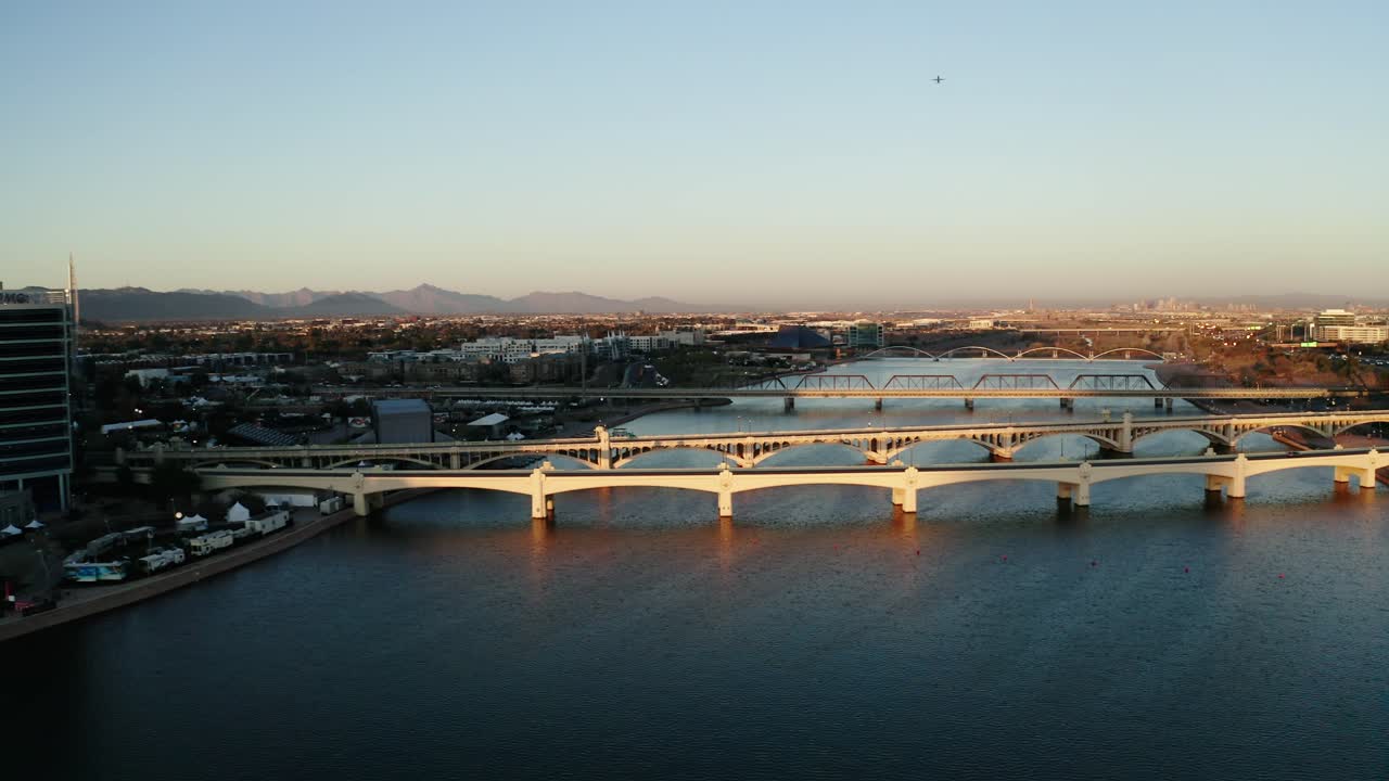 Wide drone shot of bridges crossing the Tempe Town Lake in Arizona