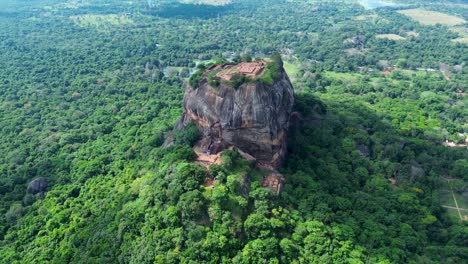 aerial drone landscape view of mountains in forest sigiriya rock formation tourism sightseeing spot in dambulla province sri lanka asia ancient palace