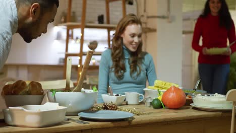 millennial adult friends celebrating thanksgiving together at home