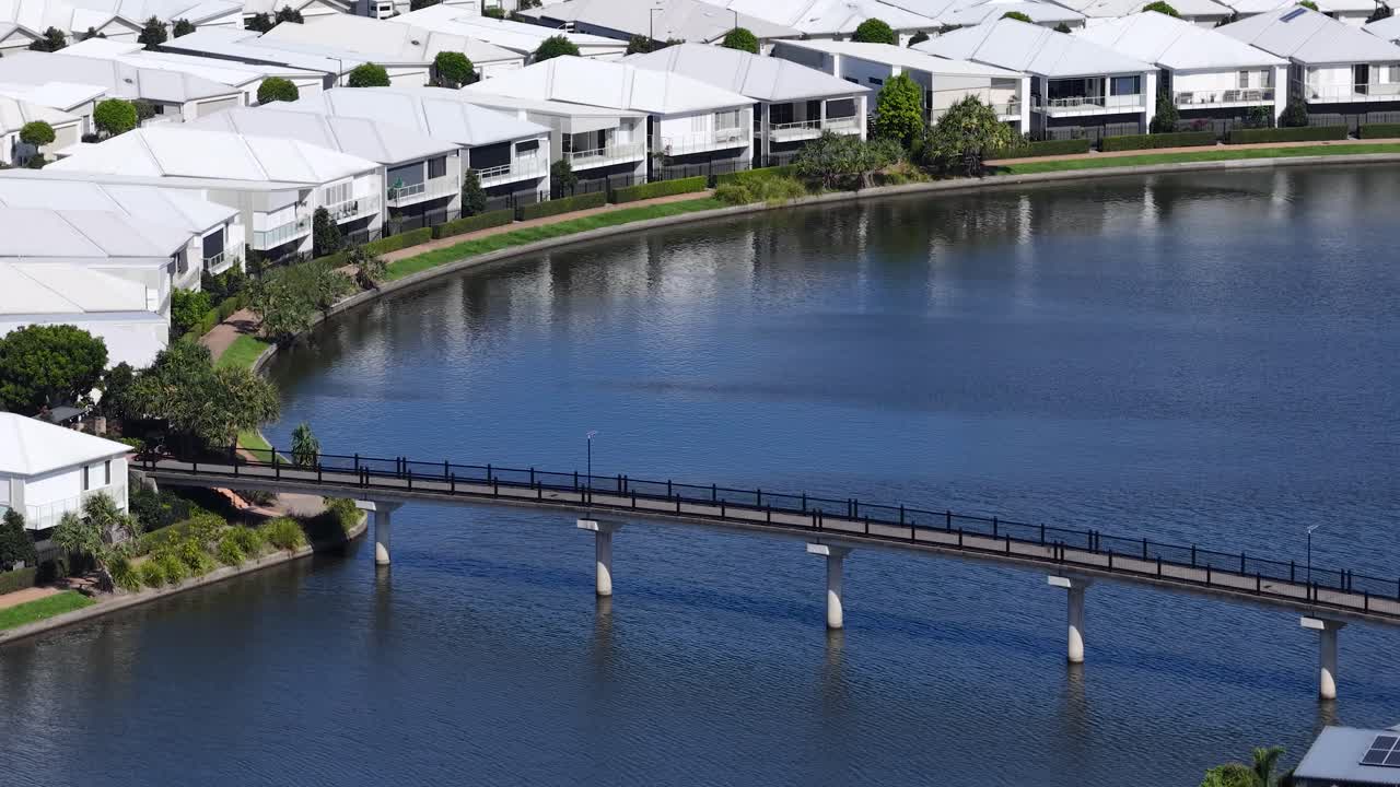 Houses on a Lake with a Bridge