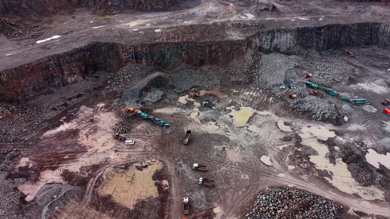 Granite extraction in a quarry with heavy machinery at work