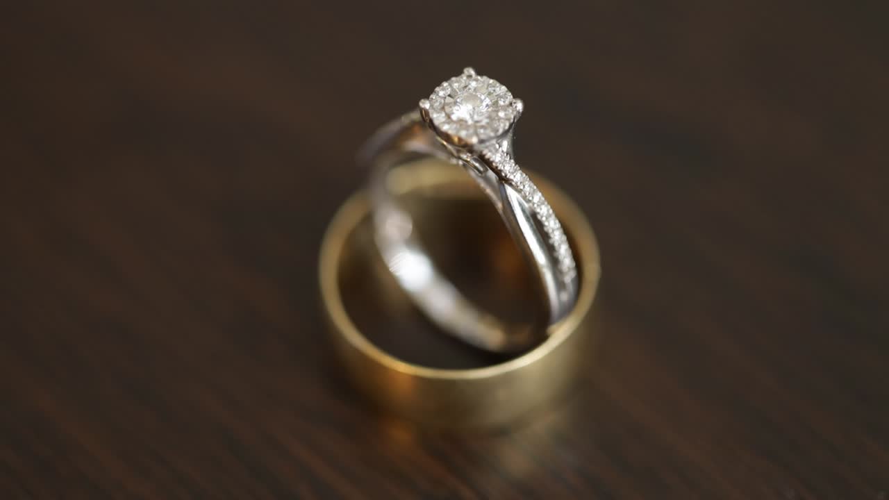 Wedding ring on a wooden table high angle shot close up