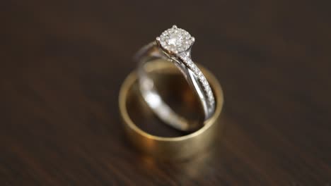 wedding ring on a wooden table high angle shot close up