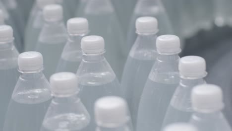 conveyor belt with bottles of drinking water at a modern beverage plant