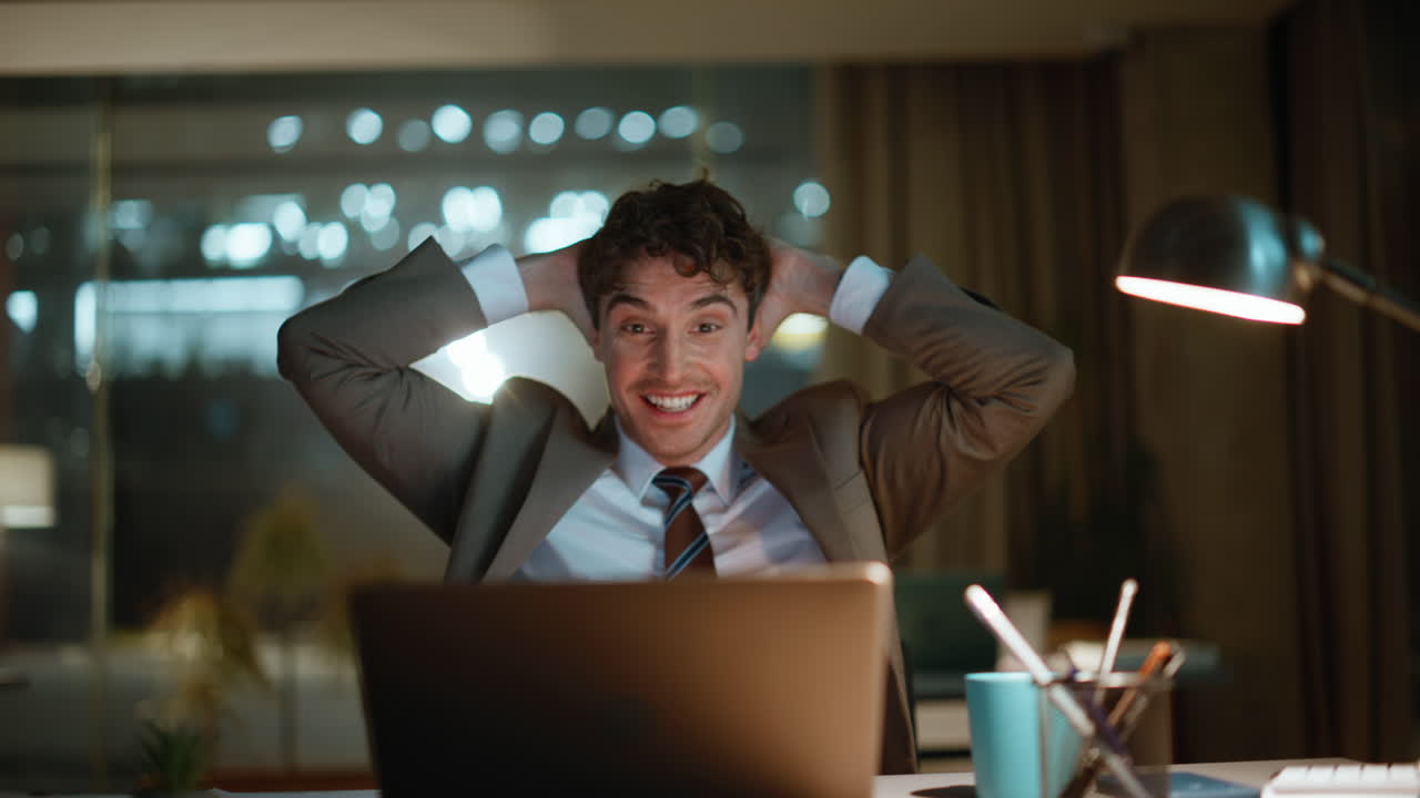 Night winner looking laptop enjoy great news at office closeup. Excited man