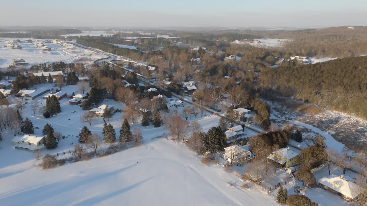Snowy town in caledon, ontario, showing homes and nature, aerial view